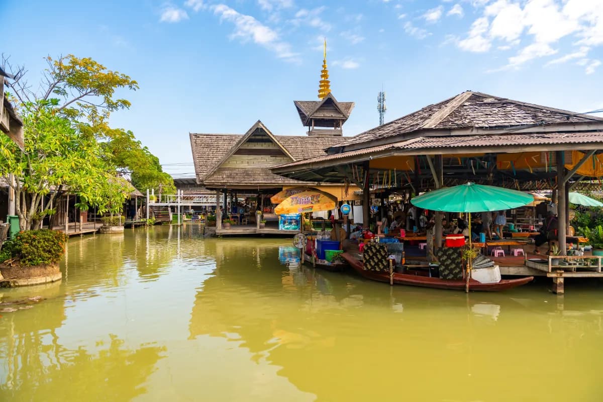 Floating open air market with small houses - shops on the pond in Pattaya, Thailand